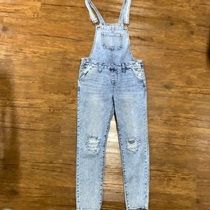 Adorable girls jean overalls with distressed crochet knees. Size 12 stretchy